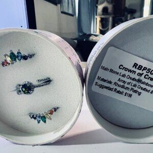 SIZE 5 RAINBOW COLORED STONES ON RHODIUM PLATING. AUTISM AWARENESS